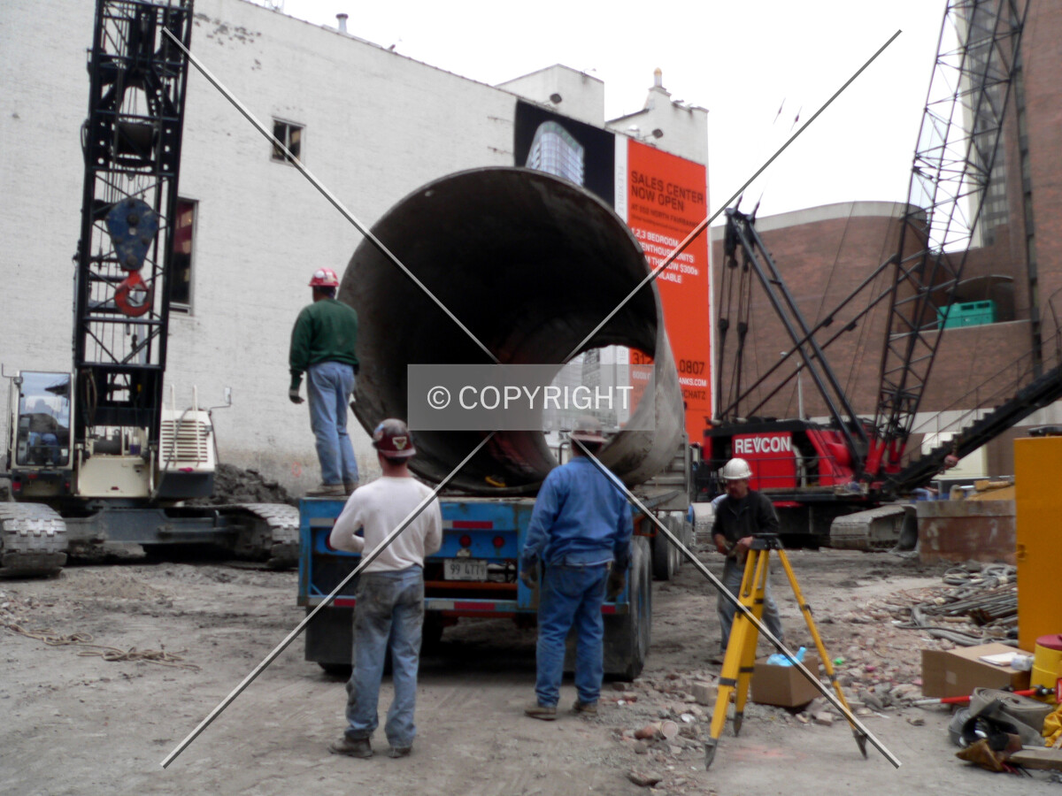 Loading a caisson top onto a flatbed truck