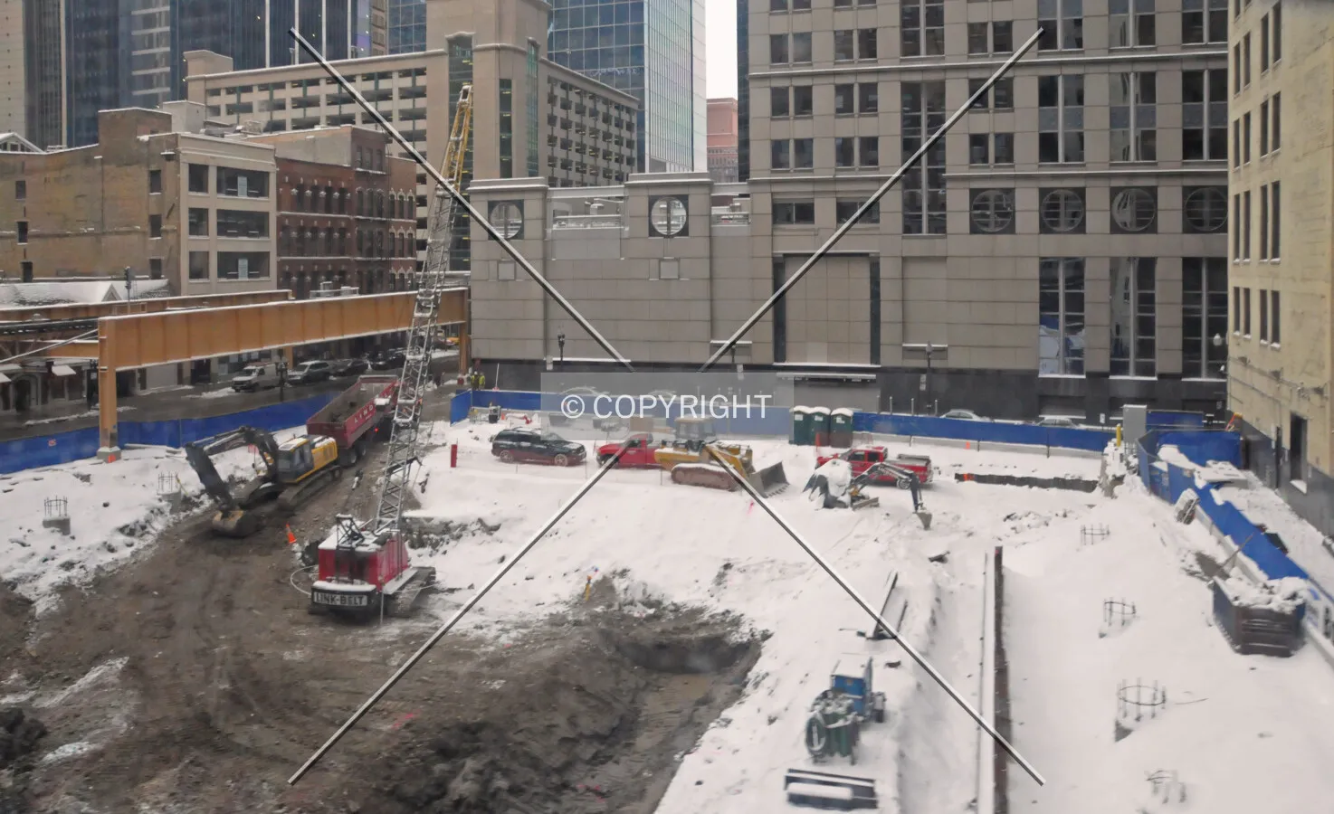Looking west across the site from the CTA Brown Line during excavation, with the tops of finished caissons visible on the right