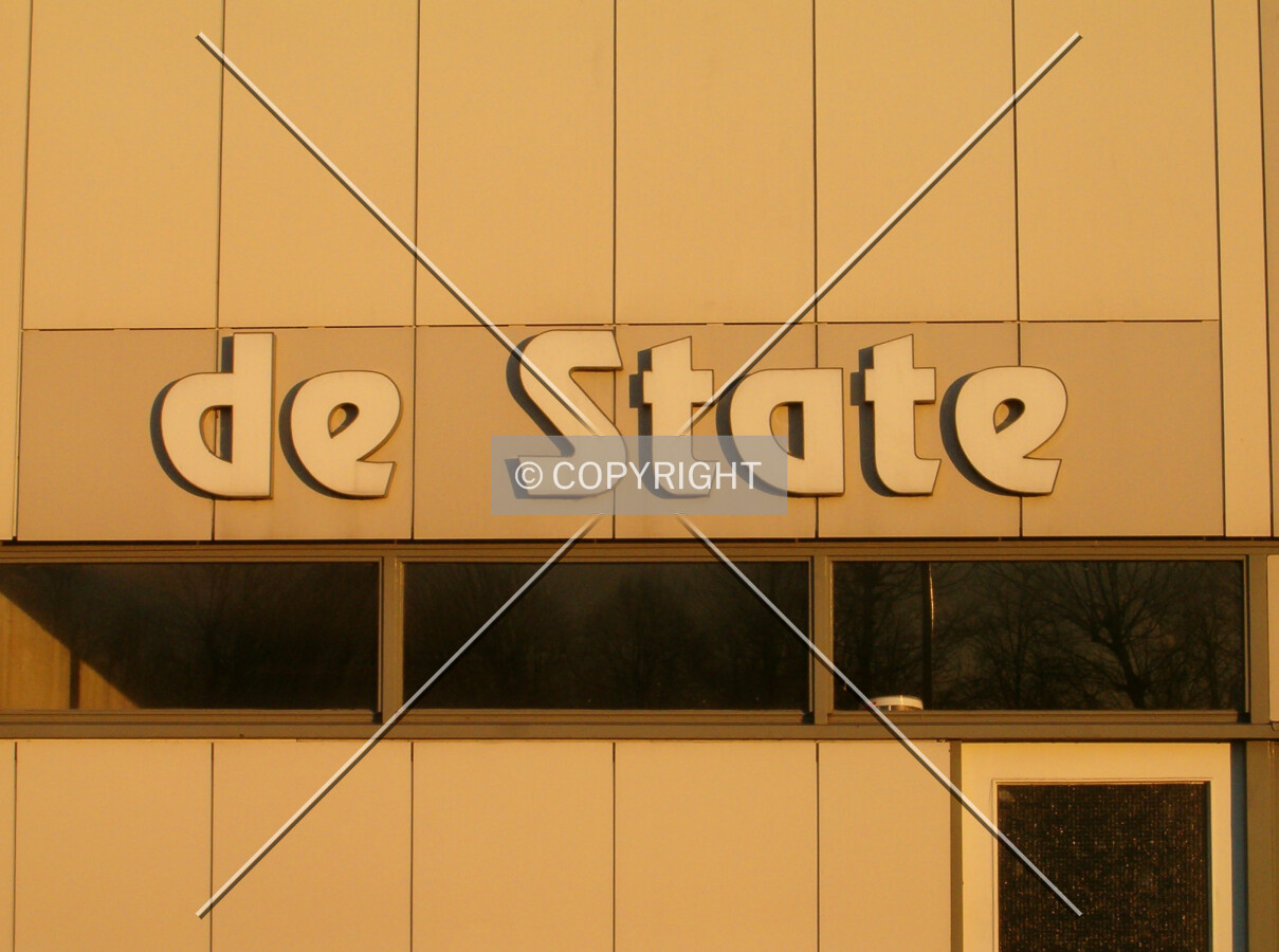 Name on the façade at sunset