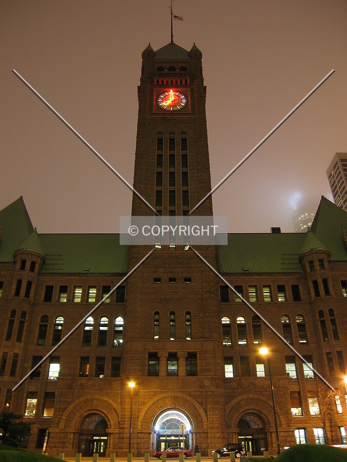 Clocktower in the eery glow of a foggy night