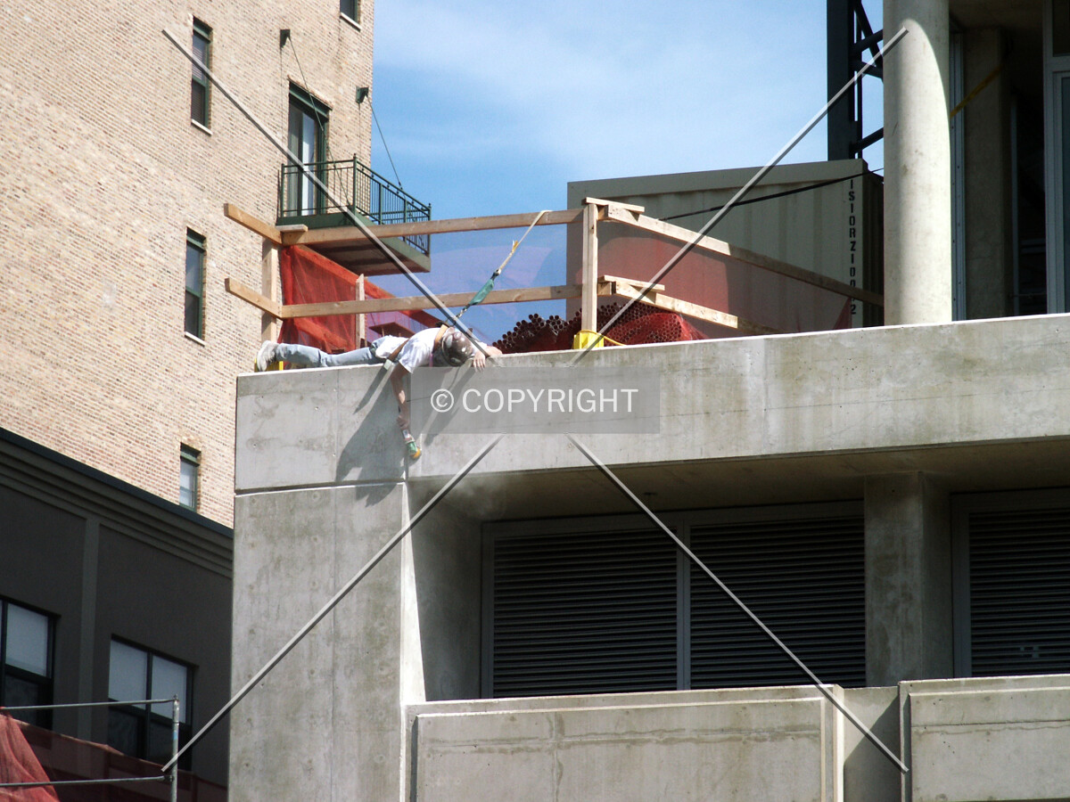 Worker treating the concrete