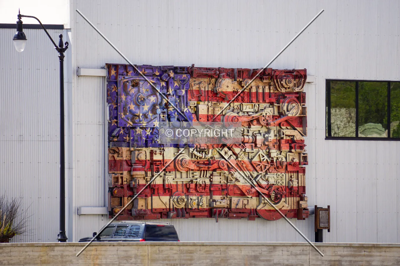A flag sculpture on the east façade; May 9, 2020