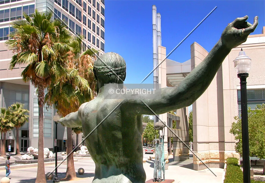 Friendly statue invites and directs you to the tower
