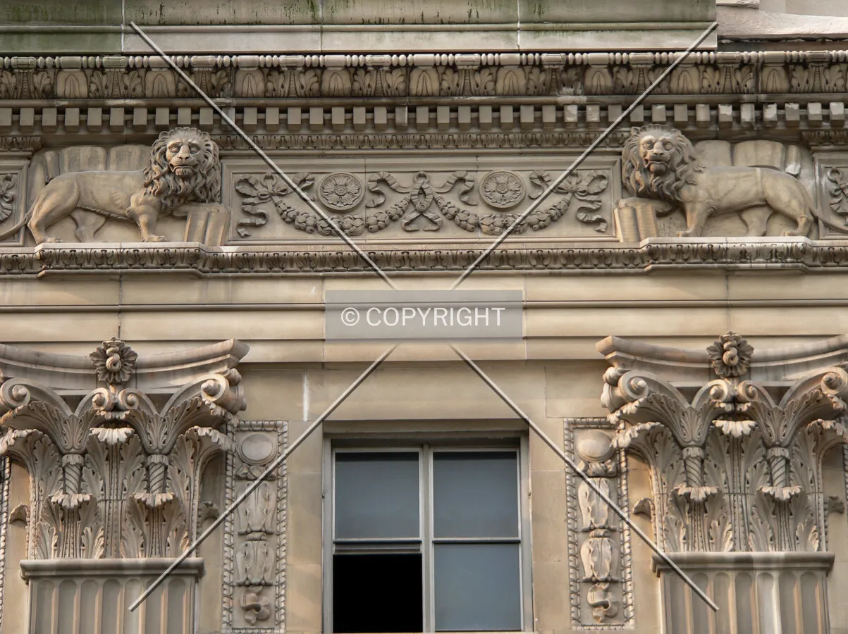 Carved limestone and detailing on the fifth floor cornice above the main entrance