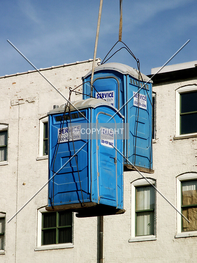 Toilets hanging from the tower crane