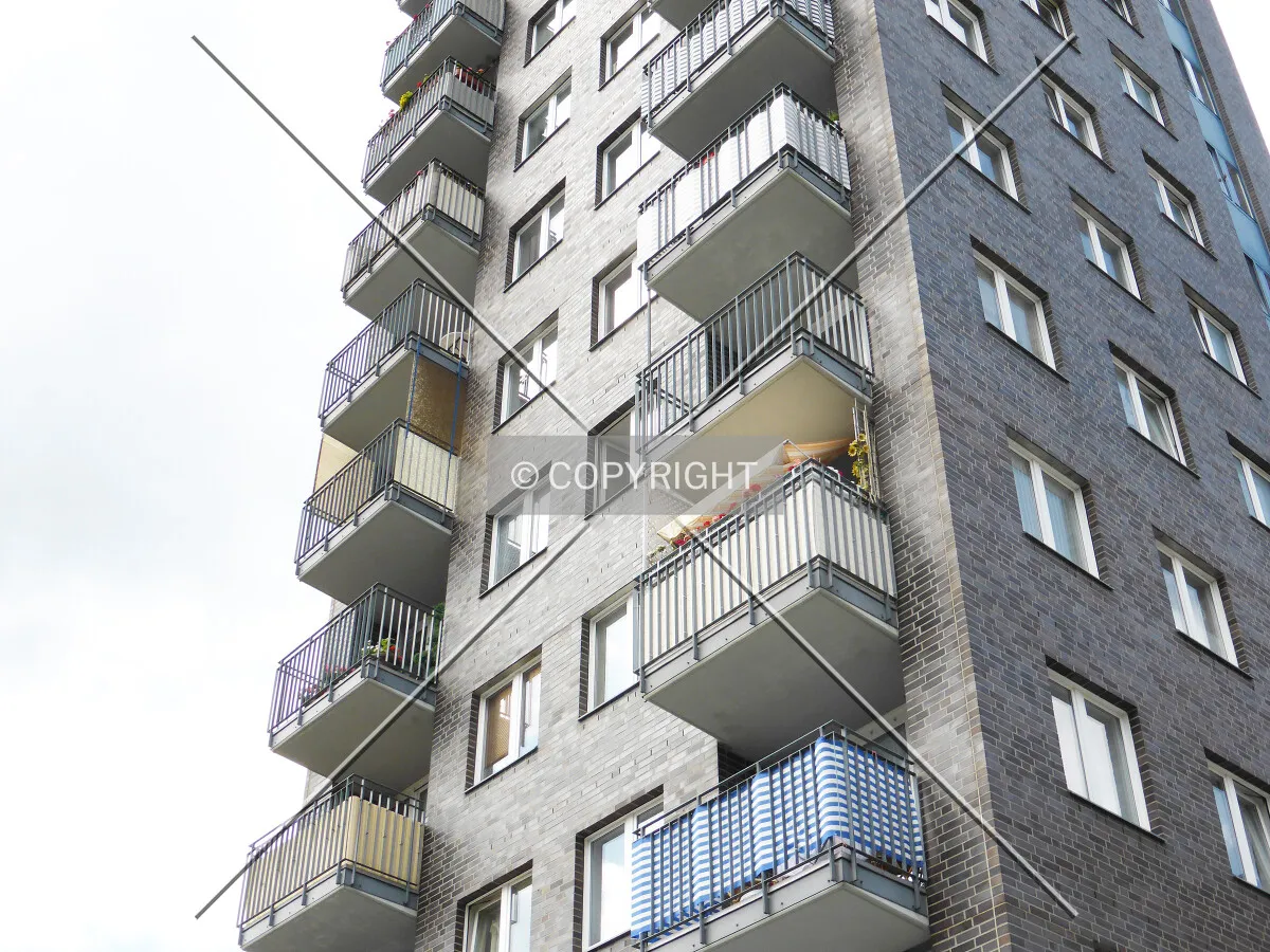 Balconies and brick facade
