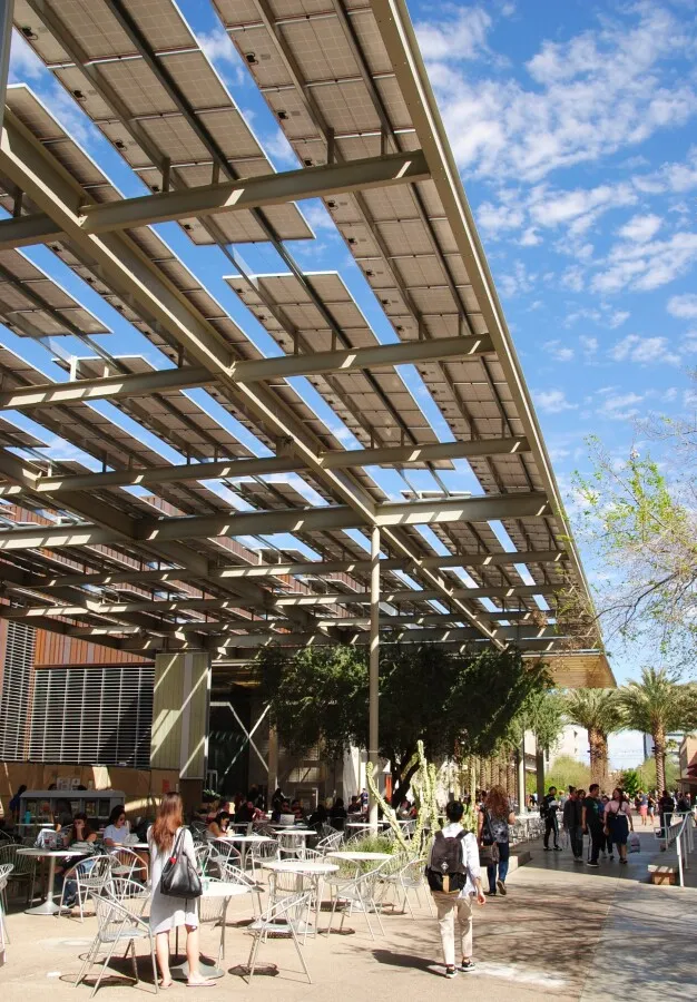 Solar panel canopy over a pedestrian walkway