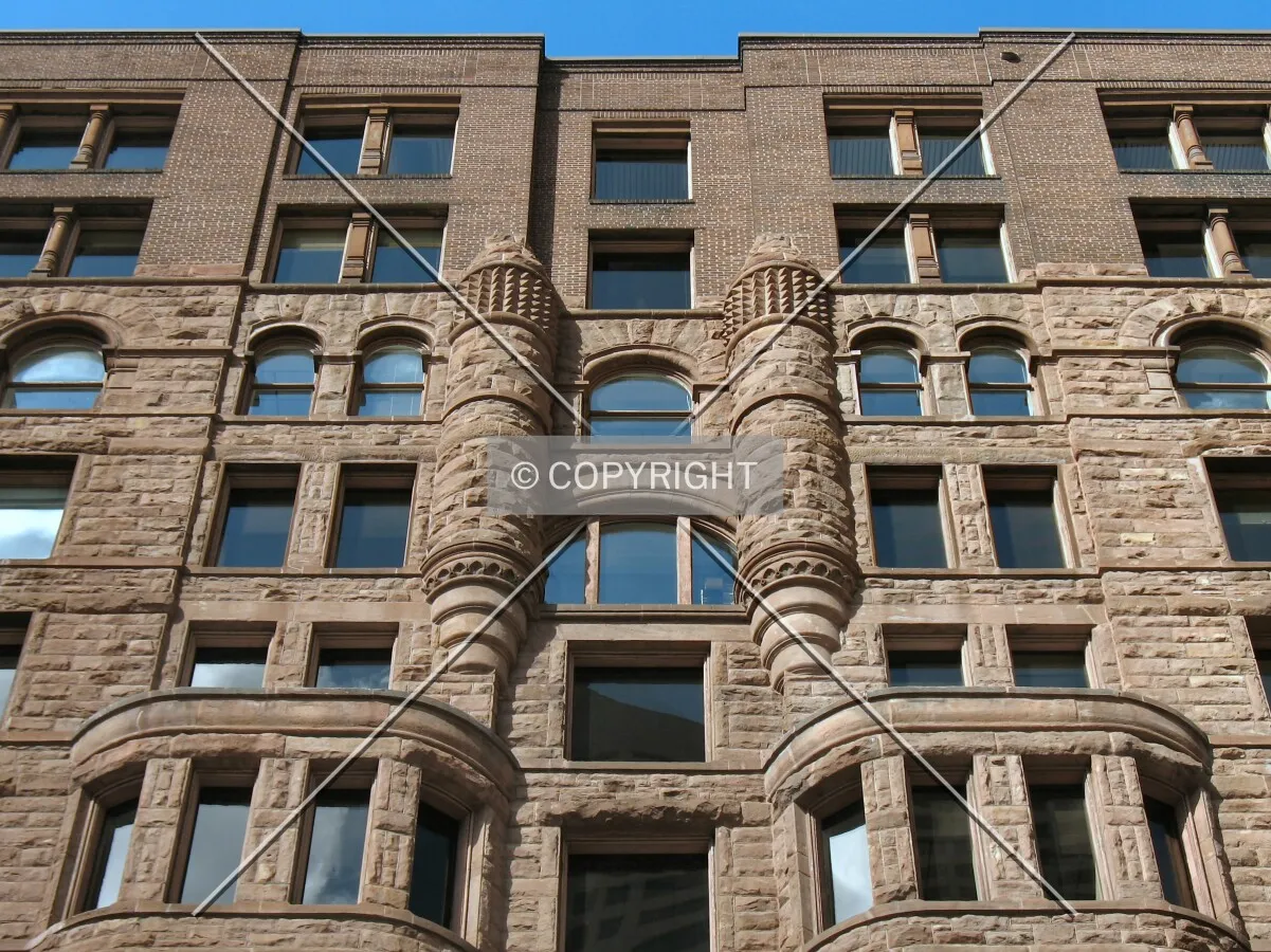 Looking up from 5th Street South, transition from original building to the vertical addition