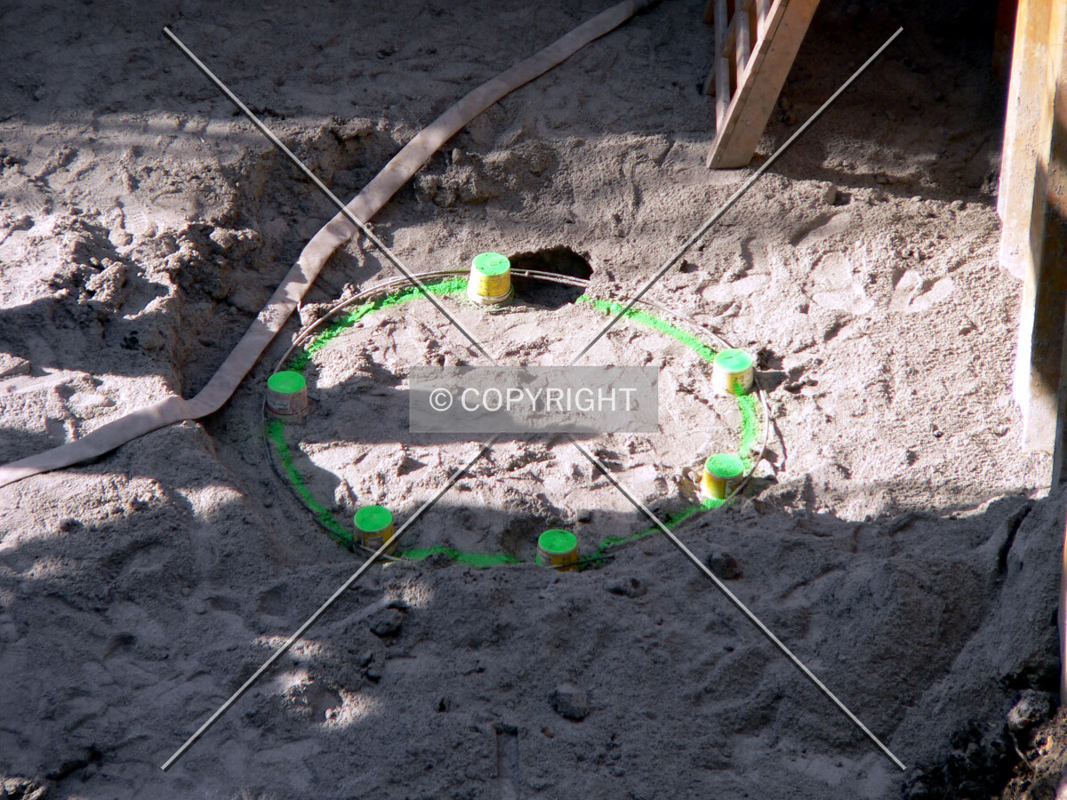 Green markings showing the location of a buried caisson