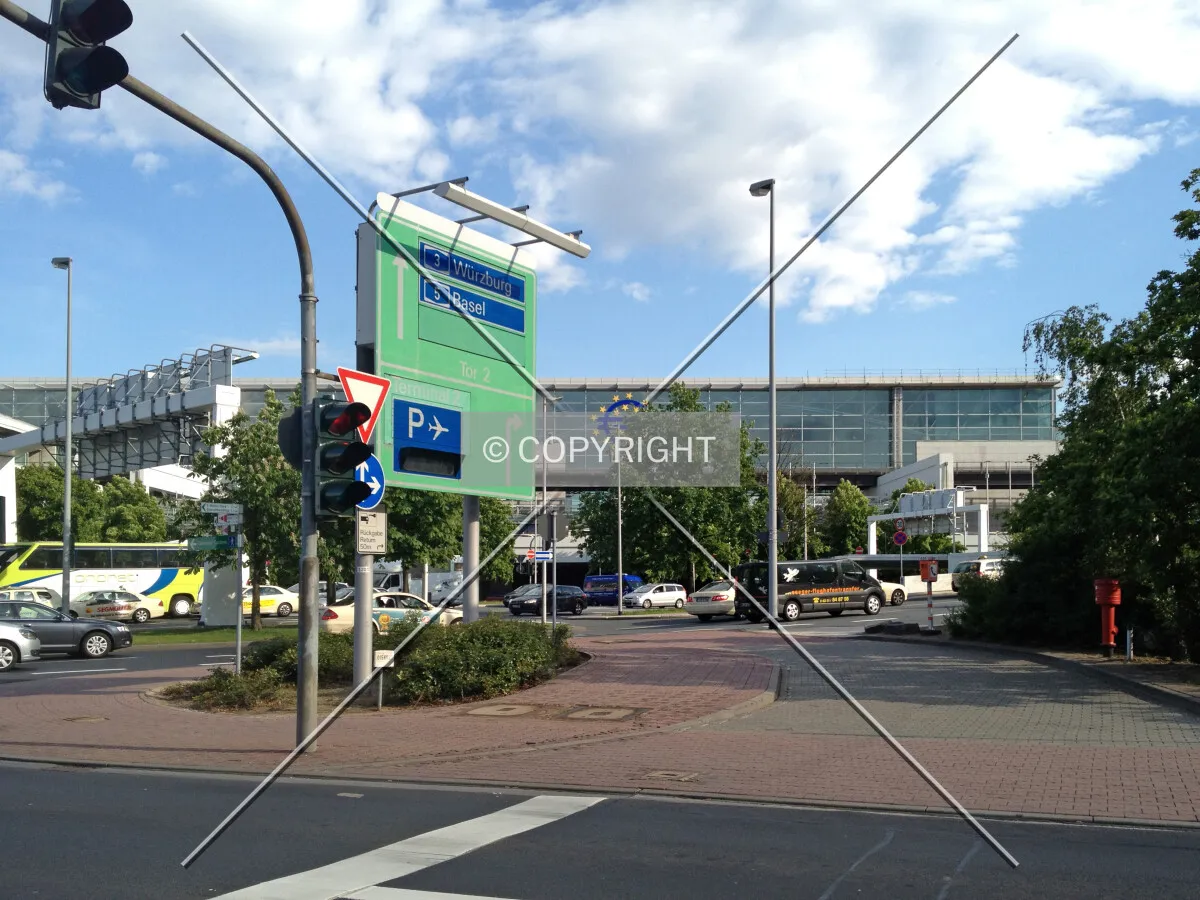 Two poles carrying one traffic sign