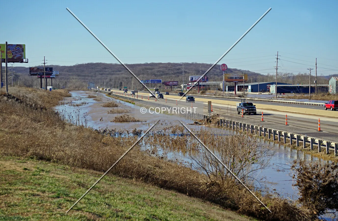 Meramec River floodwaters receding from Interstate 44 one day after the interstate was closed in Valley Park, Missouri; January 1, 2016