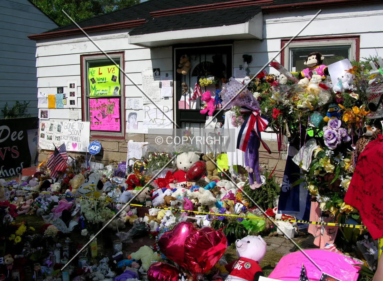 Fan tributes for Michael Jackson following his death in 2009 at the front of the home