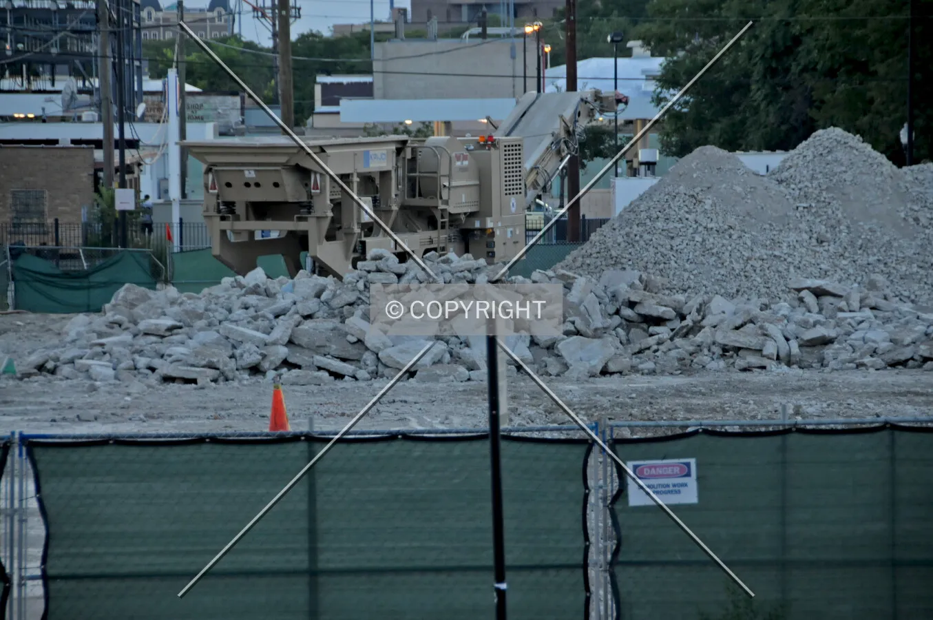 Crushing concrete from the former building at the finishing stage of demolition, looking southwest from across Canal Street. August 19, 2012.