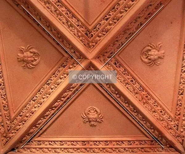 Terracotta crabs on portico ceiling