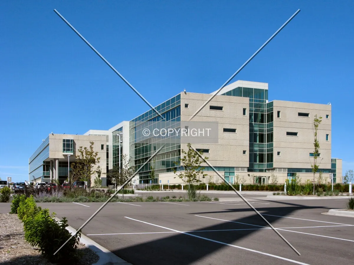 View to the west with the long shadow of the building's wind turbine
