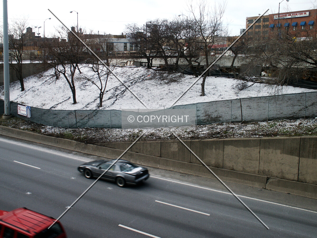 Green space between the building and the Kennedy Expressway
