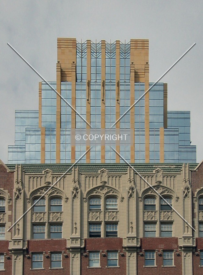 Top floors rising above the old YMCA Building, from the south
