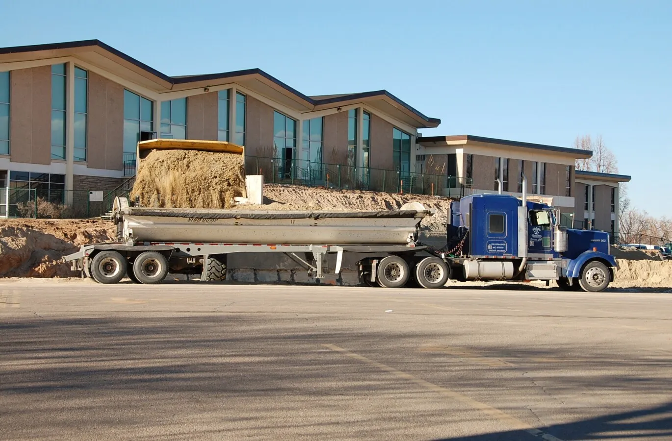 Front loader loading up a dump truck
