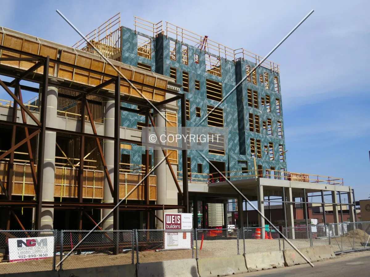 Partial preserved facade along 10th Street with new construction