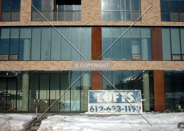 First floor sidewalk interaction, sales placard propped against windows