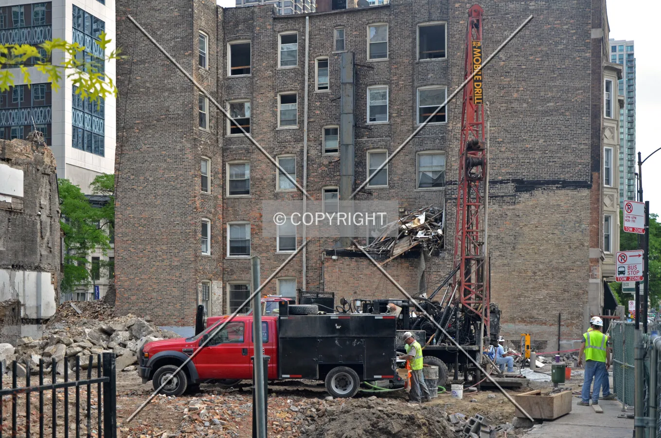 Pre-construction soil test borings drilled through the ruble of recently demolished buildings along State Street. Looking south along the site's western edge on State Street. June 27, 2013.