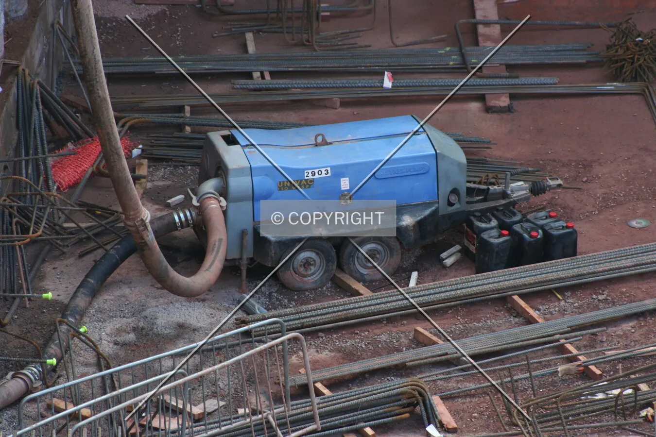 Construction equipment pumping water out of the site