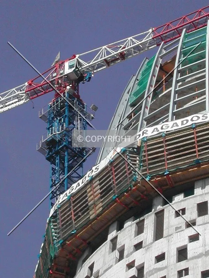Very close view of the top of the building and the crane