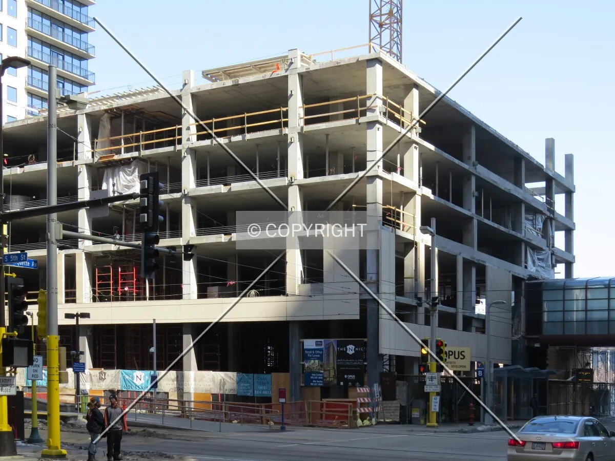 Southeast corner of the parking podium from Marquette Avenue