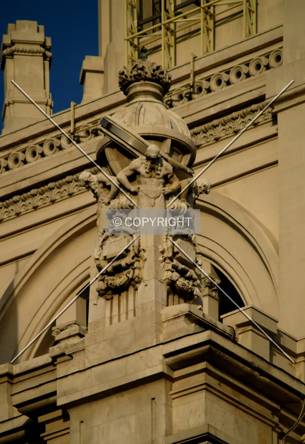 One of the sculptures in the Plaza de Cibeles side