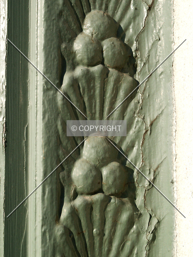 Detail of moldings in a show window frame at the base