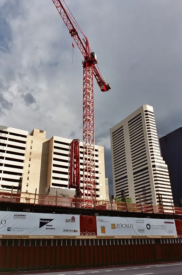 View of the tower crane near sunset