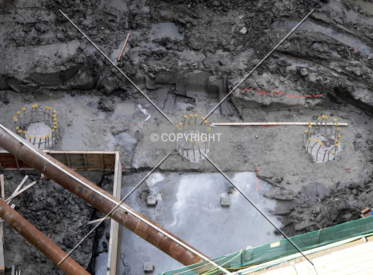 Tops of several caissons visible as excavation begins on the eastern edge of the site