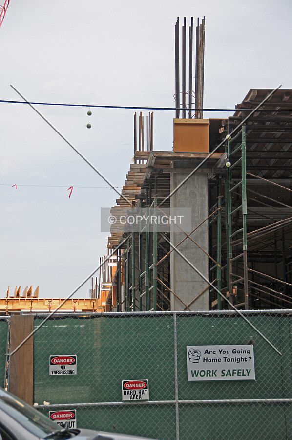Columns supporting ramps for the new attached parking structure