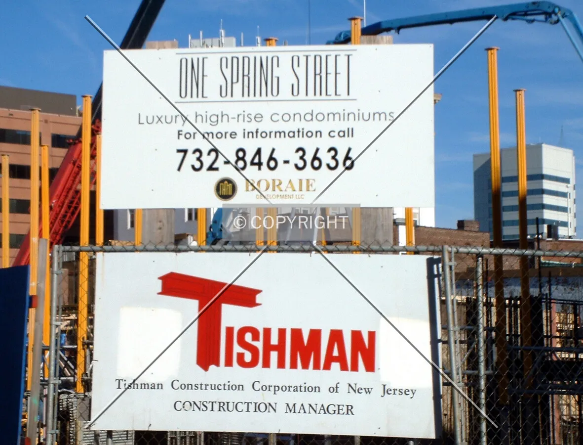 Construction signs on the south side of the site at Spring and Paterson Streets