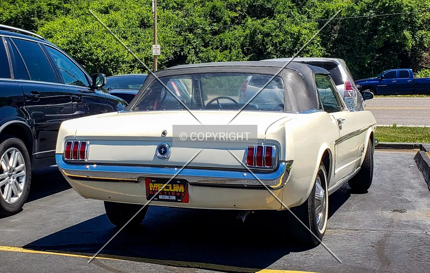 A Ford Mustang for sale out front; June 5, 2018