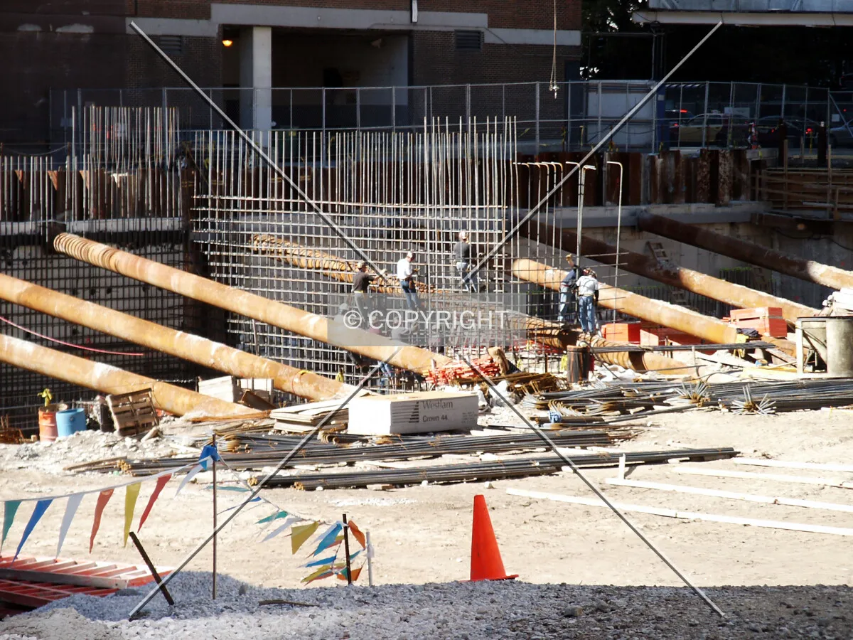 Workers taking a break to climb on the jungle gym