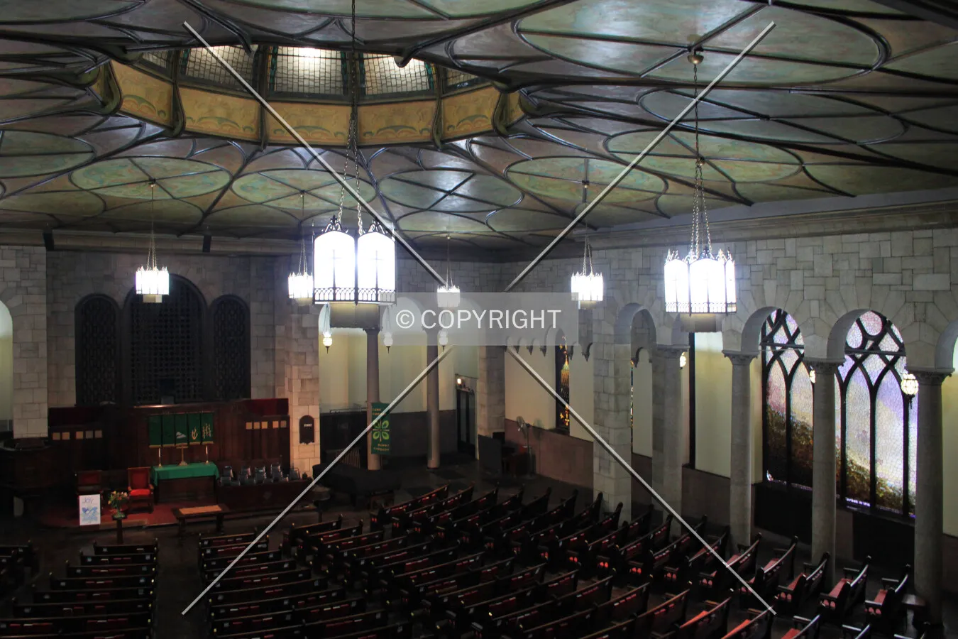 View from the gallery, with stained glass windows in the south wall