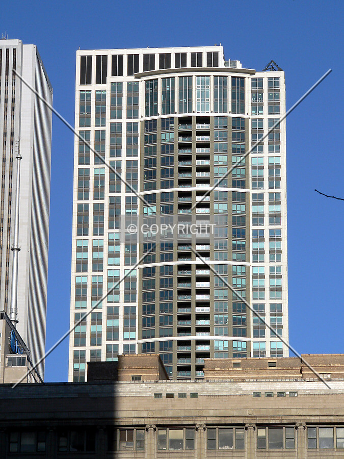 View from Daley Plaza of the Heritage rising above Marshall Field's