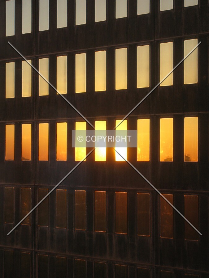 Sunset reflected by cor-ten steel and glass