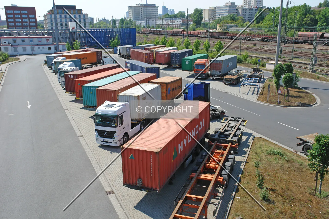 Trucks and containers on a parking lot