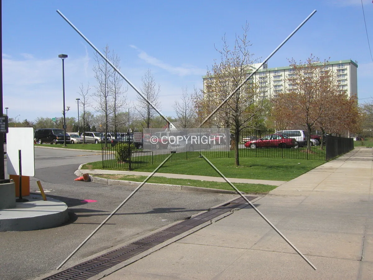 Site entrance (left) and nearby Radisson Hotel in the background