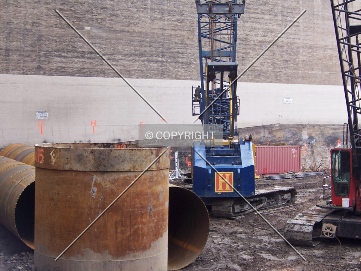 Caisson tops waiting to be used in the southwest corner of the site
