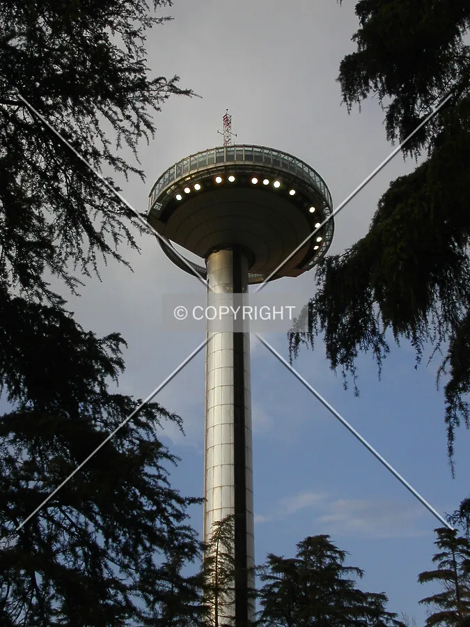 Lights under the observatory deck at dusk make it resemble a UFO