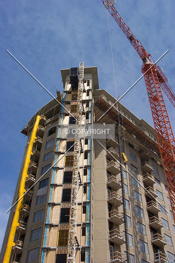 Looking up along the front of the tower at the crane