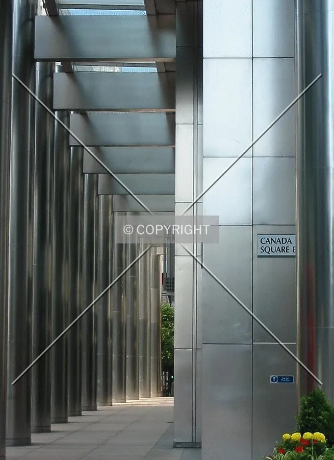 Stainless steel columns form an impressive entrance to the building on all but the west side