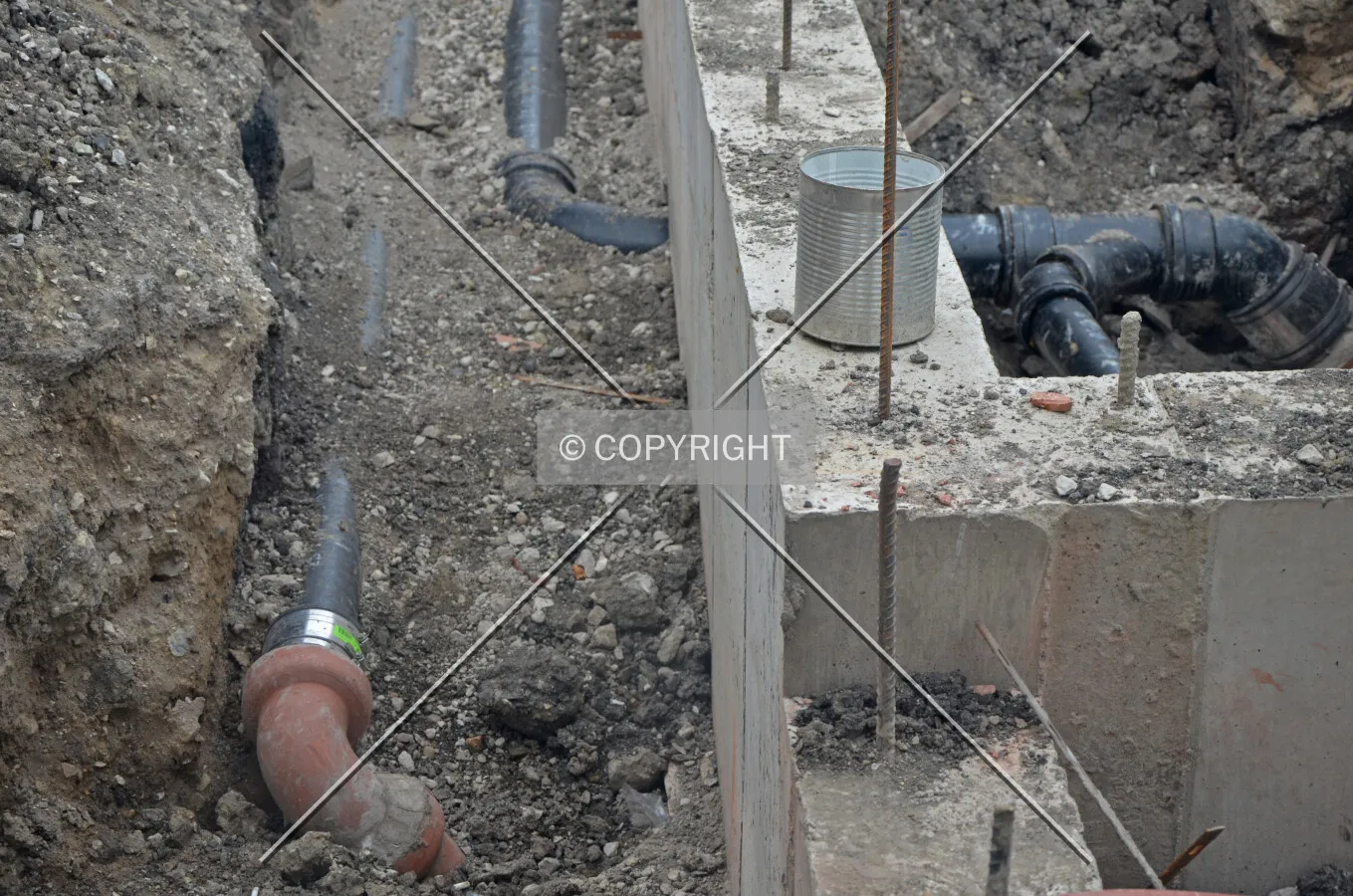 Foundation wall and plumbing detail at the west end of the site and adjacent to the original building. June 22, 2013.