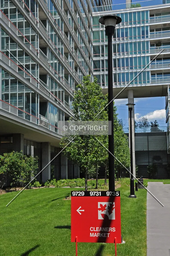 Directional sign for retail spaces at the base of the Maple Tower