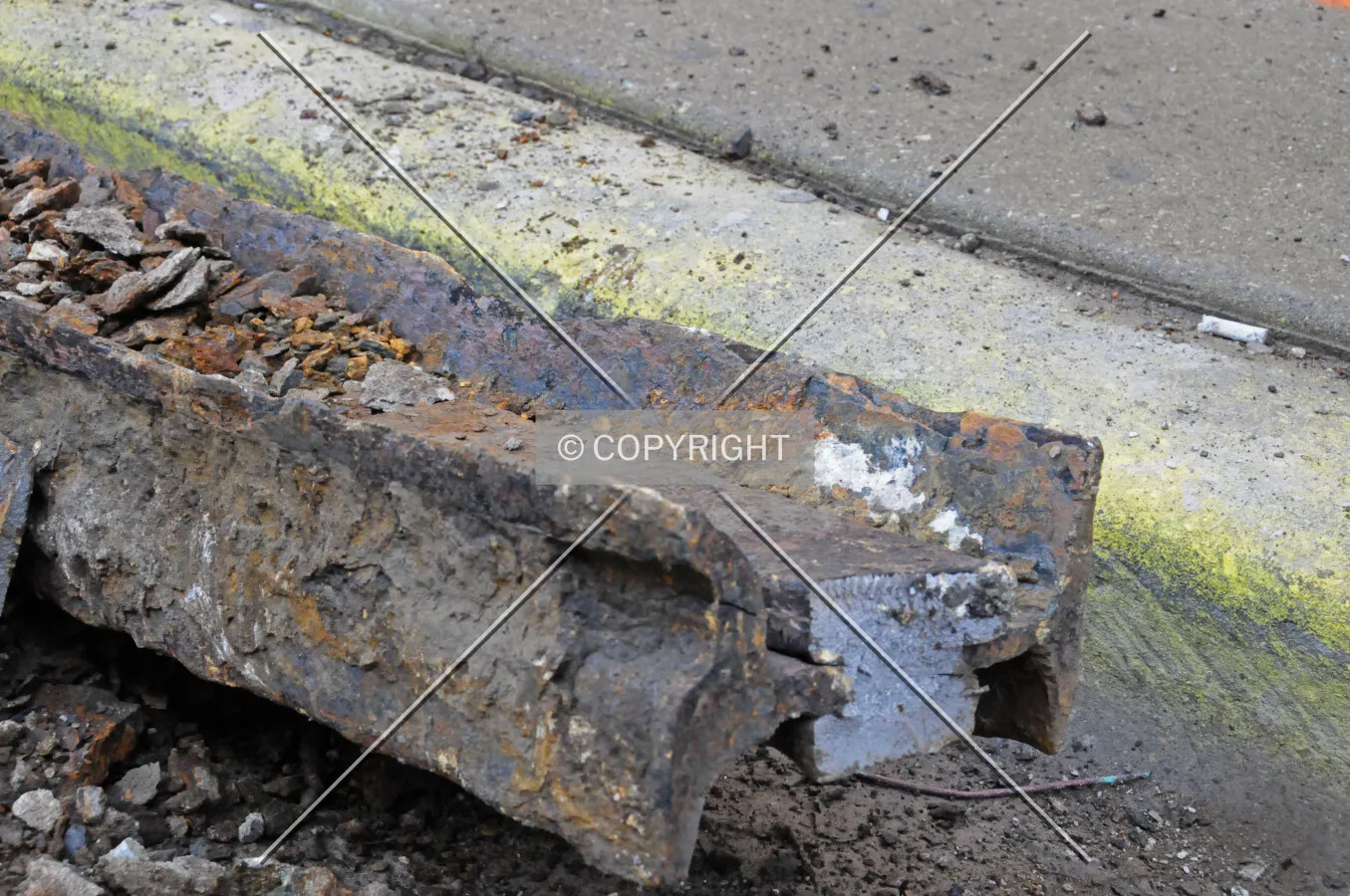 Running rail of a former street railway removed during the installation of new water pipes under Erie Street