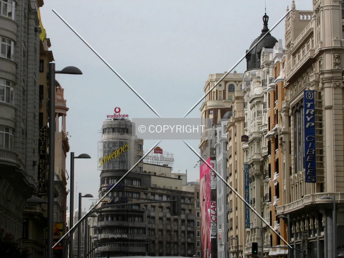 Along Gran Via, with the building in the center-left side of the photo