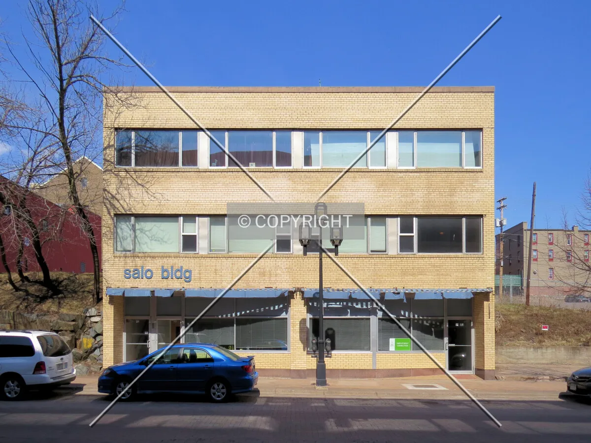 Full front elevation from across East 1st Street